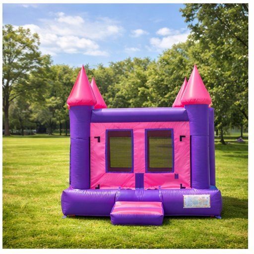Pink and purple bounce castle on grass